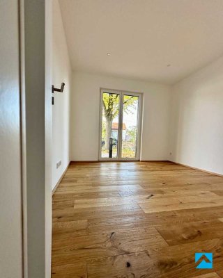 Erstbezug! Exklusive 3-Zimmer-Erdgeschosswohnung mit Terrasse, neuer Markenküche + Tiefgarage