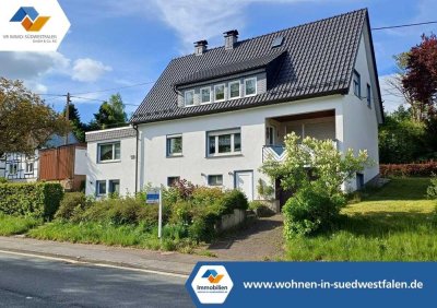 VR IMMO: Vielseitiges Ein- bis Zweifamilienhaus mit 3 Garagen in Hilchenbach- Lützel!