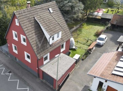 Kleines Haus, grosses Grundstück, Baugenehmigung für Neubau inklusive. Verkauf im Bieterverfahren