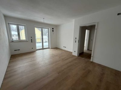 2-Zi-Neubauwohnung mit 50 m² inkl. Küche, Bad, TG & Garten
