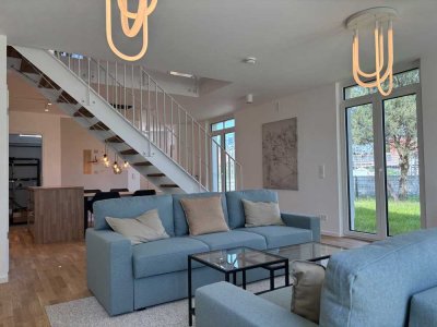 Haus mit Garten: NKM 12,55 €/ m² inkl. Gartenanteil und 2 Stellplätzen