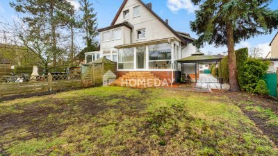 Doppelhaushälfte mit vier Zimmern, Wintergarten, Gartenidylle und Vollkeller