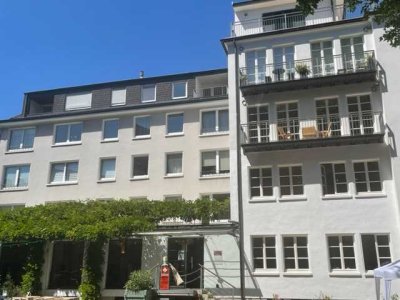 Neuwertige 2,5-Raum-Wohnung mit Süd-Terrasse und Einbauküche in zentraler Lage von Dortmund.
