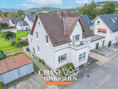 Charmante Doppelhaushälfte mit eigenem Garten und Garagen - Wohnen in TOP-Lage Lügdes!