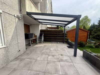 Moderne 3-Zimmer-Gartenwohnung mit überdachter Terrasse und Tiefgaragenstellplatz