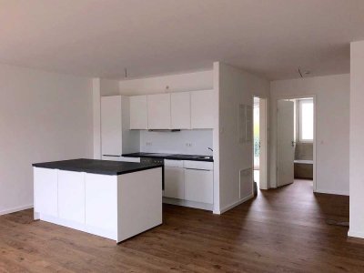 **2 Zimmer mit EBK, Fußbodenheizung & TG-Stellplatz**