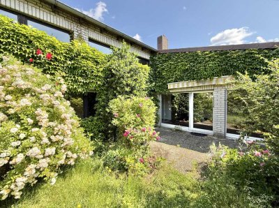 Individuelles & großzügiges Architektenreihenhaus mit schönem Garten in beliebter Lage