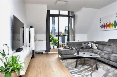 Im Herzen von Hilden: charmante DG-Wohnung, Aufzug, Balkon und TG-Platz