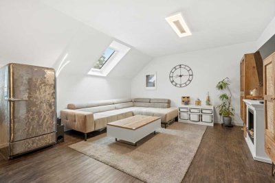 Charmante Dachgeschosswohnung mit Loggia, Tageslichtbad und Einzelgarage in Ummendorf