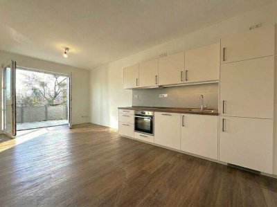 NEUBAU! LICHTDURCHFLUTETE 1-ZIMMERWHG. MIT EINBAUKÜCHE UND BALKON + PKW-STELLPLATZ