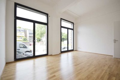 Stilvolle Loftwohnung mit Loggia – Denkmalarchitektur mit urbanem Charakter