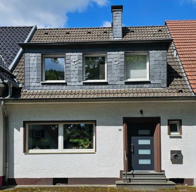 Reihenmittelhaus mit großem Garten und Garage