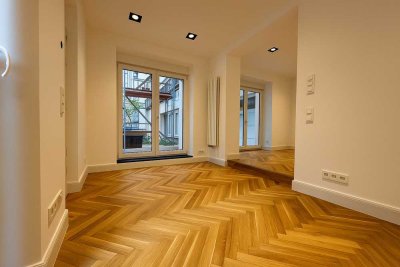 Wunderschöne Neubau-Gartenwohnung mit Terrasse. Im Hinterhaus eines gepflegten Altbaus.