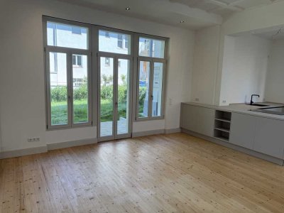 Haus im Haus mit Gartenidylle – Maisonette-Rarität im ruhigen Innenhof