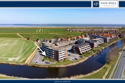 Wohnen zwischen Grün und Blau: Sanierte Erdgeschosswohnung mit Feld- und Kanalblick in Dornumersiel