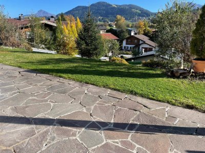 Sonnige Terrassenwohnung mit Gartenanteil