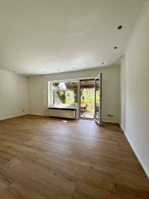 Gartenparadies mit Terrasse, eigenem Grün und TG-Stellplatz: Stilvolle 3-Zimmer-Wohnung