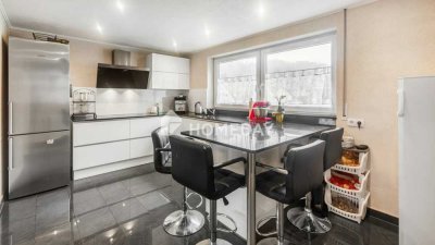 Großzügige 4,5-Zimmer-Wohnung mit moderner Ausstattung, geräumiger Terrasse und Garage