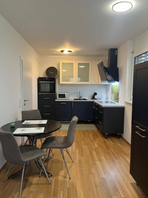 Neubau-Erstbezug: Moderne 2-Zimmer-Wohnung mit großer Terrasse &amp; Garten