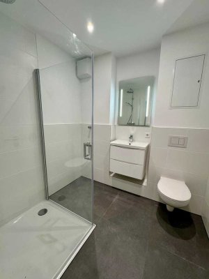 Erstbezug! Zentrale EG-Wohnung, große Terrasse, EBK