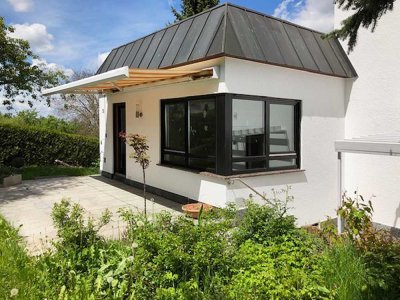 Attraktives Mehrfamilienhaus mit Kamin, Garten und flexiblem Nutzungskonzept