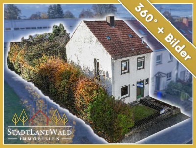 Grüner Rückzugsort in der Stadt – Reihenendhaus zum Renovieren mit Garten und Garage