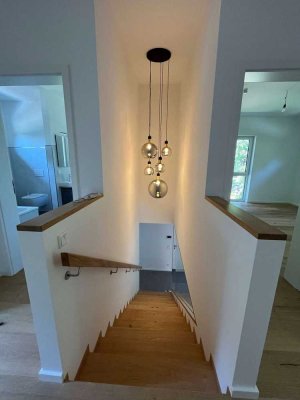 Ein architektonisches Juwel in Seenähe – Stilvolles Erstbezugsdomizil für höchsten Wohnkomfort