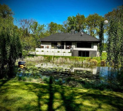 Vollsanierter Winkelbungalow als Kleinod auf sonnigem Seerosengrundstück in Fintel zu verkaufen