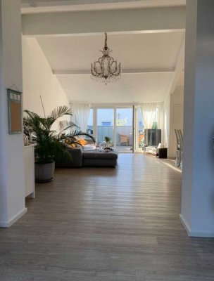 Loftartige Wohnung mit Sonnenterrasse und 2 Parkplätzen