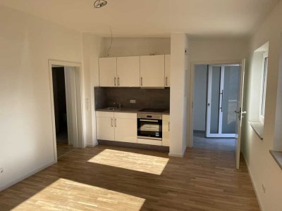 Moderne 2-Zimmer-Wohnung mit Terrasse, Einbauküche & Abstellraum – KfW 55