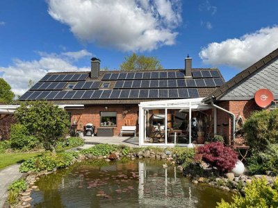 Sonnige Gartenidylle mit Teich – Ihr neues Zuhause in Tarp mit Ausbaupotenzial