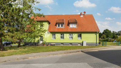 Mehrfamilienhaus mit vier Einheiten auf großem Grundstück