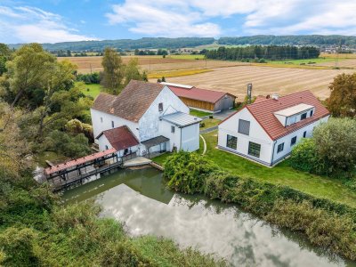 Exklusives Wohnen in Alleinlage: Modernes Landhaus mit vielseitigen Nutzungsmöglichkeiten