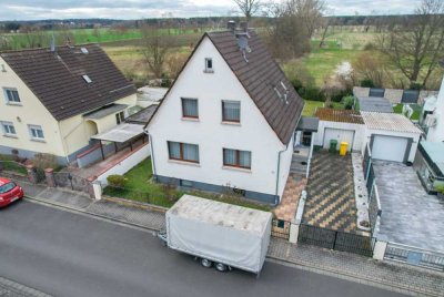 DIETZ: Modernisierungsbedürftiges Einfamilienhaus mit Garten in direkter Feldrandlage von Rollwald!