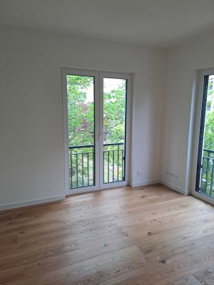Luxus-Neubau in Grunewald | 2. OG mit Aufzug | Balkon & Parkblick