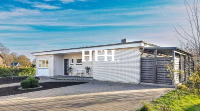 Moderner Bungalow mit lichtreichem Untergeschoss und idyllischem Gartenparadies