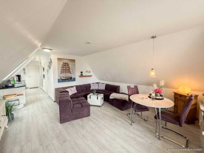 Stilvolle 1,5‑Zimmer‑Dachgeschosswohnung mit Südbalkon und Meerblick – zentral in Büsum