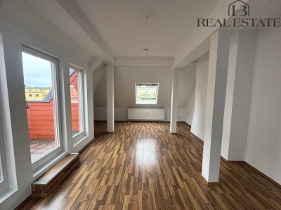 Moderne 2-Zimmer-Wohnung mit offener Küche und sonniger Dachterrasse