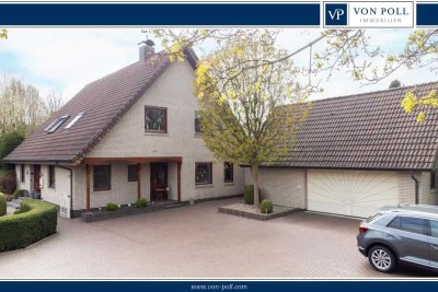 Platz für Visionen – Stilvolles Einfamilienhaus mit Wintergarten in familienfreundlicher Lage