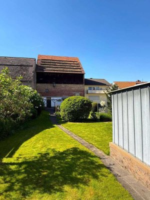 Viel Raum für Ideen - Einfamilienhaus in Hüttenfeld mit Garten und Grundstück mit Baupotenzial!