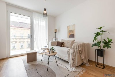 ERSTBEZUG mit ca. 7 m² BALKON | 2-Zimmer Neubau | Fernwärme | TG-Stellplatz optional | Nachhaltiges Wohnbauprojekt