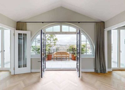 Exklusives Penthouse mit großzügigen Terrassen und Bogenfenstern