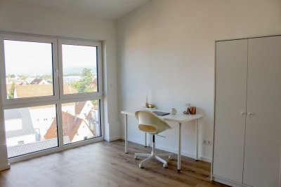 Neubau! Helle Dachgeschosswohnung - 2 Zimmer, möbliert, mit Blick über die Stadt