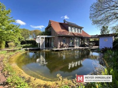 Exklusives Einfamilienhaus mit Naturschwimmteich in Varel-Obenstrohe (Obj.-Nr. 6505)