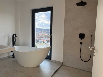 Einzigartige Neubauwohnung mit freistehender Badewanne und Dachterrasse