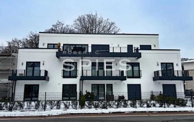 Großzügige Neubauwohnung mit Terrasse und Gartenanteil