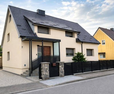 Neuwertiges Wohnhaus in Bestlage mit Einliegerwohnung und Gästeappartment!