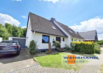 Familiengerechte Doppelhaushälfte mit Vollkeller und Garage auf idyllischem Grundstück
