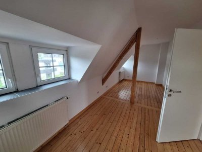 Wohnen mit Charme: Stilvolle Wohnung mit Holzbalken in zentraler Lage