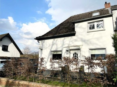Wohnen mit Weitblick – Doppelhaushälfte mit riesigem Grundstück in Top-Lage!